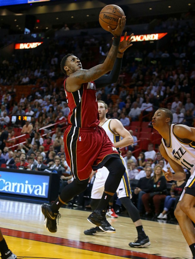 Former Miami Heat point guard Mario Chalmers goes for a layup against the Utah Jazz in this file photo.