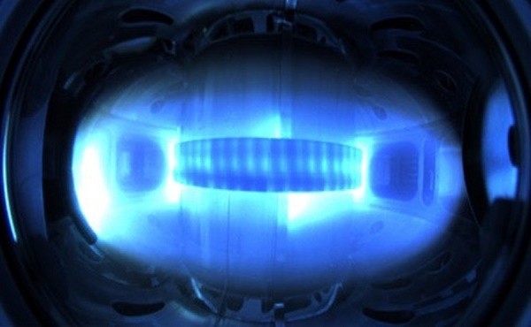 Magnetically confined plasma in the Korean superconducting tokamak, KSTAR. The extreme temperature plasma radiates in a spectrum that our eyes can not see. What is visible in this image are the colder regions on the outer edge of the plasma.