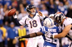 Denver Broncos quarterback Peyton Manning (#18) throws against the Indianapolis Colts.