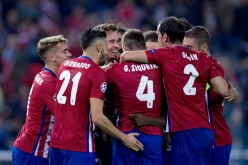 Atletico Madrid players celebrate a goal during their Champions League match against Astana.