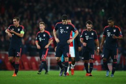 Bayern Munich players walk off the pitch after their loss to Arsenal in a recent Champions League match.