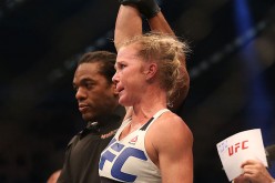 Holly Holm celebrates victory over Ronda Rousey in their UFC women's bantamweight championship bout during the UFC 193 event at Etihad Stadium on November 15, 2015 in Melbourne, Australia. 