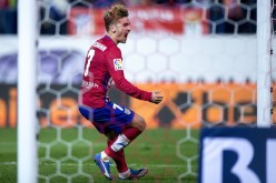 Atletico Madrid foward Antoine Griezmann scores his team's first goal in a recent game against Sporting Gijon.