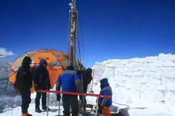 Scientists dig ice cores in the Qinghai-Tibetan Plateau to study climate change.