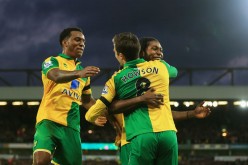 Norwich City players celebrate Jonathan Howson's goal against Swansea City.
