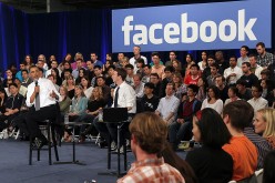 Facebook CEO Mark Zuckerberg is seen with President Barack Obama, who is speaking on the state of economy at a town hall style meeting organized at Facebook headquarters.