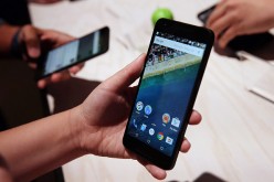 An attendee inspects the new Nexus 5X phone during a Google media event on September 29, 2015 in San Francisco, California. 
