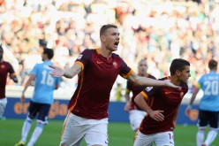 Roma striker Edin Džeko celebrates after scoring the opening goal against SS Lazio.