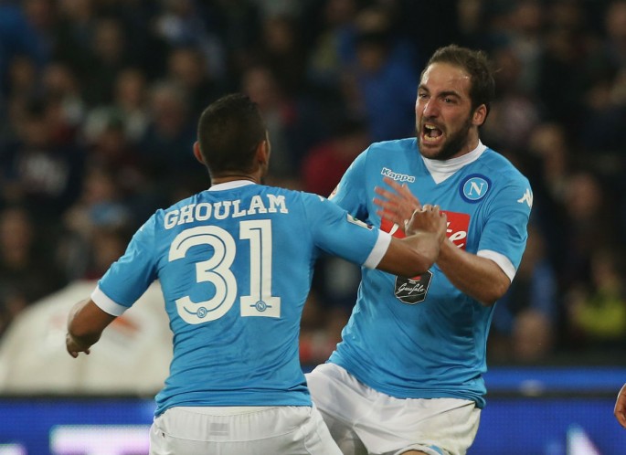 Napoli striker Gonzalo Higuaín celebrates with defender Faouzi Ghoulam after scoring the winning goal against Udinese.