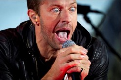 Chris Martin performs with U2 during a surprise concert in support of World AIDS Day in Times Square in New York, December 1, 2014.