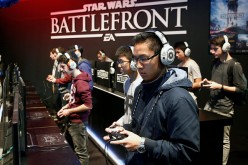  Visitors play a video game 'Star Wars Battlefront' published by Pandemic Studios at the Paris Game Week, a trade fair for video games on October 28, 2015 in Paris, France.