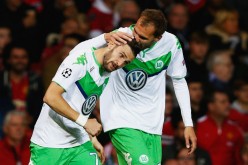 Wolfsburg's Daniel Caligiuri (L) and Bas Dost.
