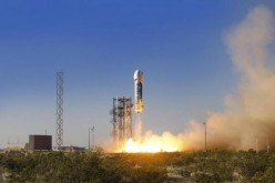 The New Shepard space vehicle blasts off on its first developmental test flight over Blue Origin's west Texas launch site in this handout provided by Blue Origin.