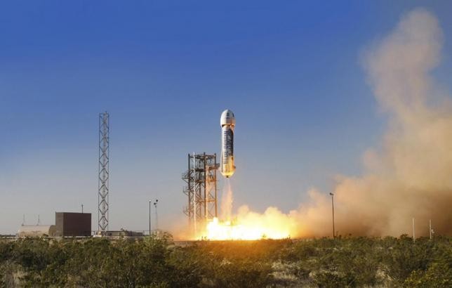 The New Shepard space vehicle blasts off on its first developmental test flight over Blue Origin's west Texas launch site in this handout provided by Blue Origin.