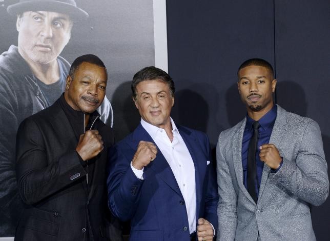 Carl Weathers poses with cast members Sylvester Stallone and Michael B. Jordan during the premiere of the film ''Creed'' in Los Angeles, California November 19, 2015.