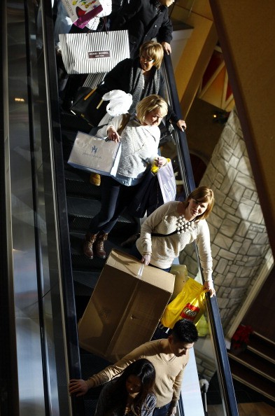  Shoppers ride an escalator as they shop for Black Friday deals at Somerset Collection shopping mall on November 29, 2013 in Troy, Michigan. Black Friday is one of the busiest shopping days of the year, where retailers offer discounted merchandise. 