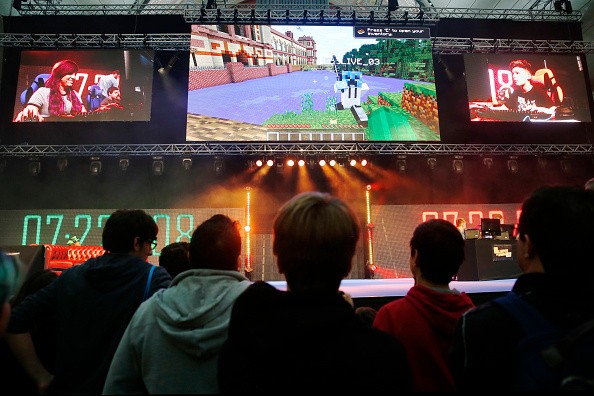 Visitors watch as professional gamers and members of the audience compete at Minecraft on the main stage at the Legends of Gaming Live event in London, on Saturday, Sept. 5, 2015. 