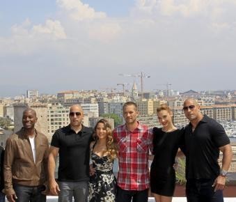 "Fast & Furious 5" cast members Tyrese Gibson, Vin Diesel, Elsa Pataky, Paul Walker, Gal Gadot and Dwayne Johnson pose during a photocall at the premiere of the film in Marseille in 2011.
