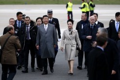 Chinese President Xi Jinping and his wife Peng Liyuan arrive at Orly airport, outside Paris, on Nov. 29, 2015, for the start of the COP21 U.N. Climate Change Conference.