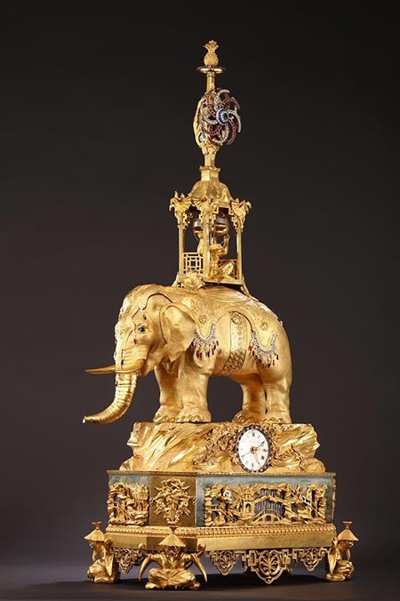 The gilded-bronze chime clock is believed to show certain British clock-making techniques that were popular during the time of King George III (1738-1820).