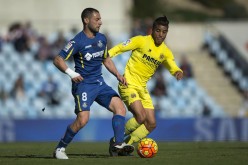 Villarreal winger Matias Nahuel (R) competes for the ball against Getafe's Mehdi Lacen.