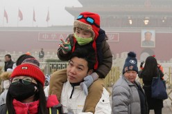Parents have gotten used to letting their children out despite Beijing's heavy pollution.