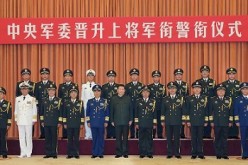 President Xi Jinping, general-secretary of the Communist Party of China (CPC) Central Committee and chairman of the Central Military Commission (CMC), poses for a group photo with millitary officers.