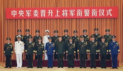 President Xi Jinping, general-secretary of the Communist Party of China (CPC) Central Committee and chairman of the Central Military Commission (CMC), poses for a group photo with millitary officers.