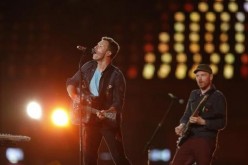 Chris Martin (L) performs with his band Coldplay in the Olympic Stadium during the closing ceremony of the London 2012 Paralympic... 