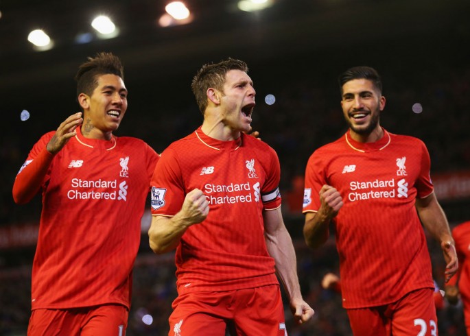 Liverpool midfielder James Milner (C) celebrates his goal with Roberto Firmino (L) and Emre Can.