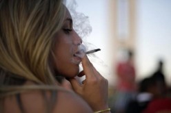 |Woman Smoking Cannabis Cigarette