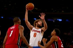 Chris Bosh and Hassan Whiteside defending Robin Lopez of the Knicks