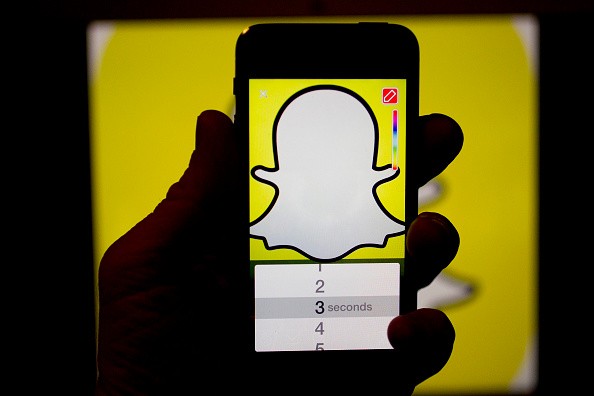 The Snapchat Inc. application (app) is displayed for a photograph on an Apple Inc. iPhone 5s in Washington, D.C., U.S., on Wednesday, Feb. 18, 2015. 