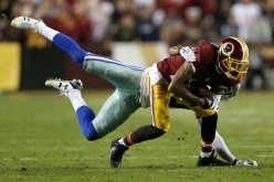 Washington Redskins wide receiver DeSean Jackson (R) was sacked by Dallas Cowboys' Brandon Carr.