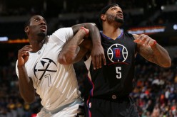 Los Angeles Clippers power forward Josh Smith (R) boxes out Denver Nuggets' JJ Hickson during a rebound battle.