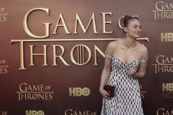  Actress Sophie Turner gestures while arriving for the season premiere of HBO's ''Game of Thrones'' in San Francisco, California March 23, 2015