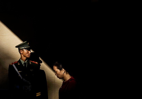 A Chinese paramilitary police officer guards in an underground tunnel near Tiananmen Square in this Oct. 1, 2015 photo.