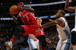 Houston Rockets point guard Ty Lawson tries to shoot over Denver Nuggets' Jameer Nelson.