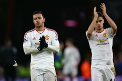 Manchester United's Memphis Depay (L) and Andreas Pereira applaud fans at the Vitality Stadium after their loss to AFC Bournemouth.