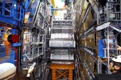 Scientists working at the Large Hadron Collider reported .signs of a possible new subatomic particle