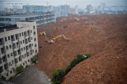 Rescuers work at the landslide site of an industrial park in Shenzhen, south China's Guangdong Province, Dec. 20, 2015. 