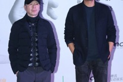 Veteran directors (L) Feng Xiaogang and (R) Guan Hu pose together before the press during the launch of CFDG Young Directors Support Program in Beijing on Dec. 19.