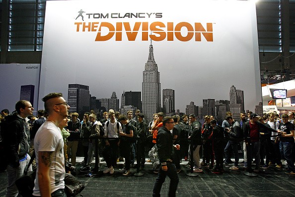 Visitors wait to play Tom Clancy's The Division, a video game published by Ubisoft at the Paris Game Week a trade fair for video games on October 28, 2015 in Paris, France.