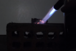 Burning a solid magnesium metal is part of a sacrificial anode from a hot water heater. 