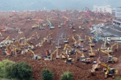 Rescue workers dig through debris to look for survivors at the Shenzhen landslide accident site.