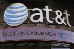 The signage for an AT&T store is seen in New York October 29, 2014.