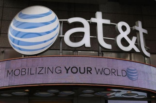 The signage for an AT&T store is seen in New York October 29, 2014.