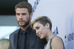 Liam Hemsworth and Miley Cyrus during the premier of 