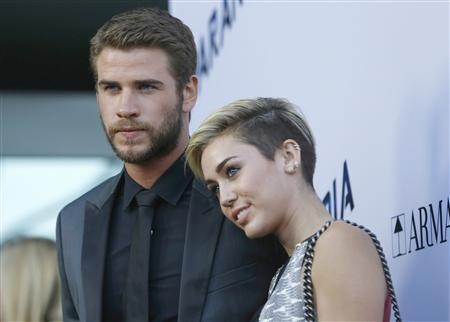 Liam Hemsworth and Miley Cyrus during the premier of "Paranoia"