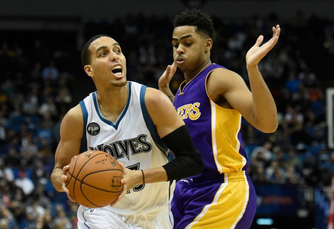 Minnesota Timberwolves shooting guard Kevin Martin (L) drives past Los Angeles Lakers rookie D'Angelo Russell.